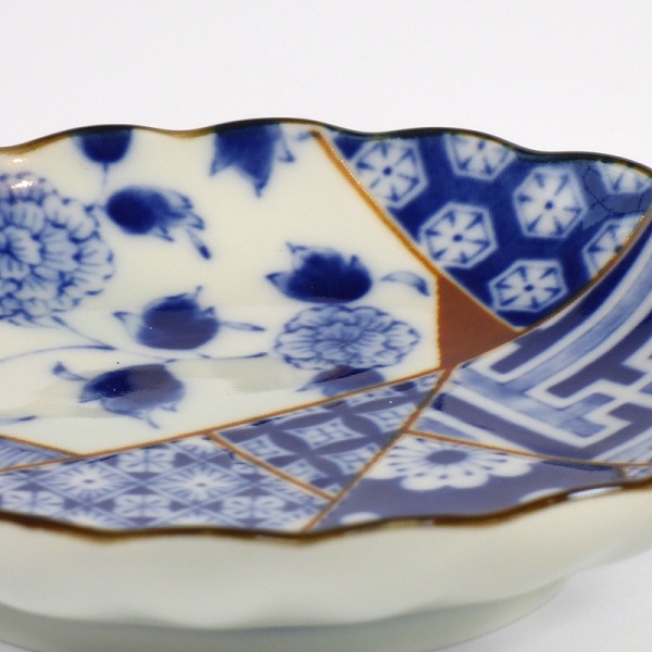 Close up of small Japanese plate with patchwork design