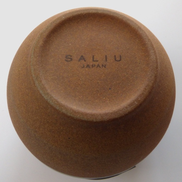 Unglazed underside of Korokoro cup showing SALIU brand