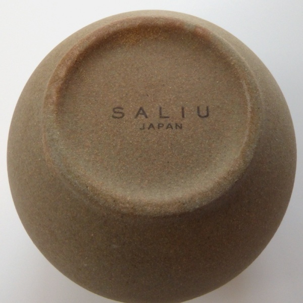 Unglazed underside of Korokoro cup showing SALIU brand