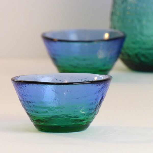 Two 'Ocean' blue green glass sake cups