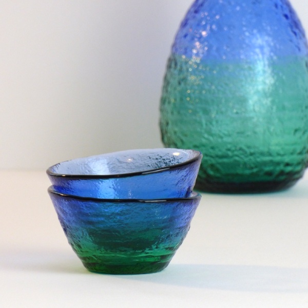 Two 'Ocean' blue green glass sake cups