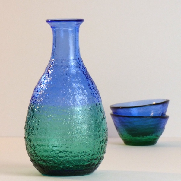 Blue green glass sake jug with two matching sake cups