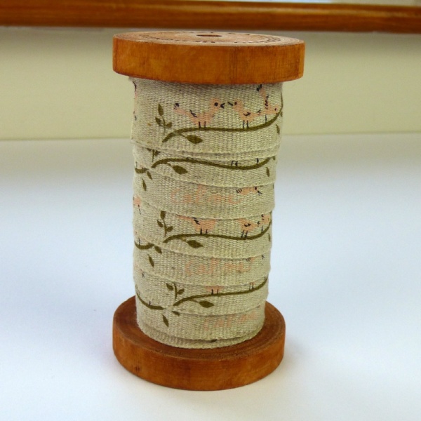 Pink Birds linen tape on wooden reel