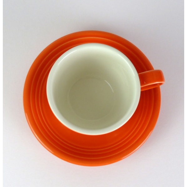 Mandarin orange coffee cup and saucer top view