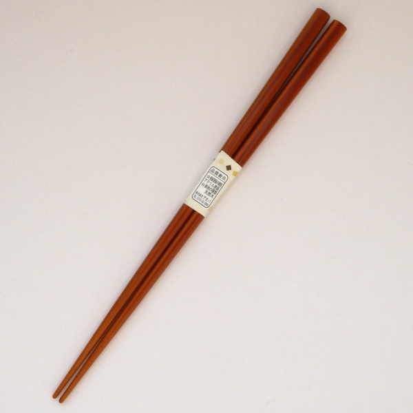 Mid tone natural wood Japanese chopsticks with flower designMid tone natural wood Japanese chopsticks with flower design