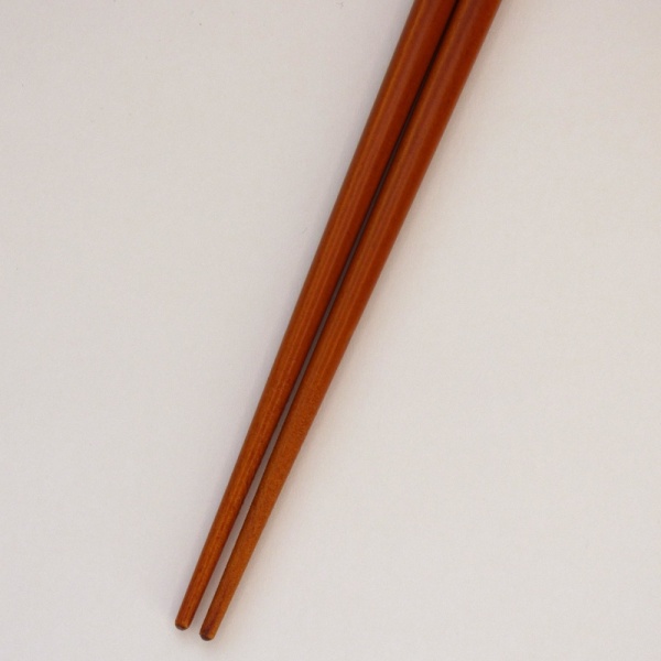 Mid tone natural wood Japanese chopsticks with flower design