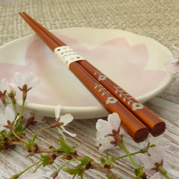 Natural wood flower pattern Japanese chopsticks on pink Sakura plate
