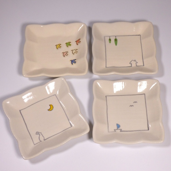 Set of four square mini plates with different designs