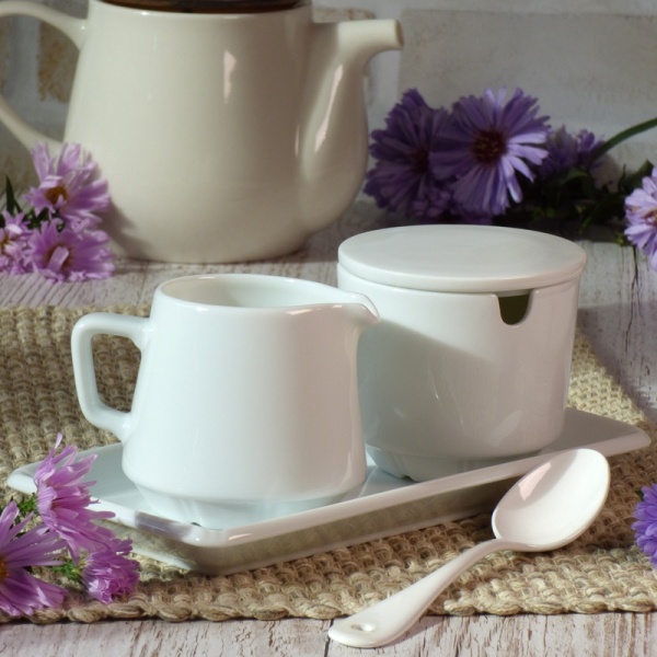 Japanese ceramic milk jug and sugar bowl set on breakfast table