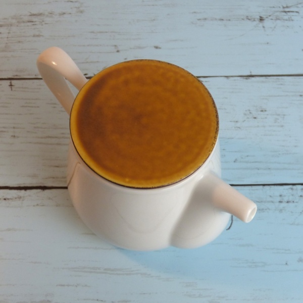 White ceramic Japanese teapot with caramel-coloured lid