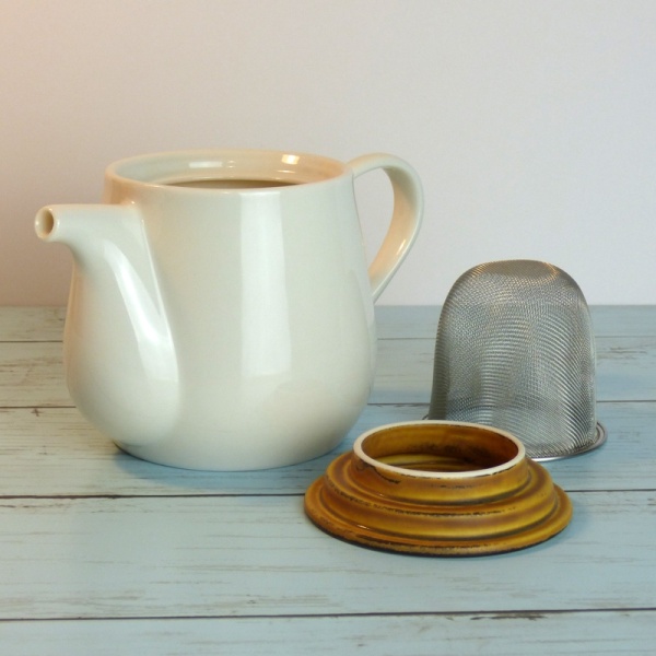 White ceramic Japanese teapot with removable strainer