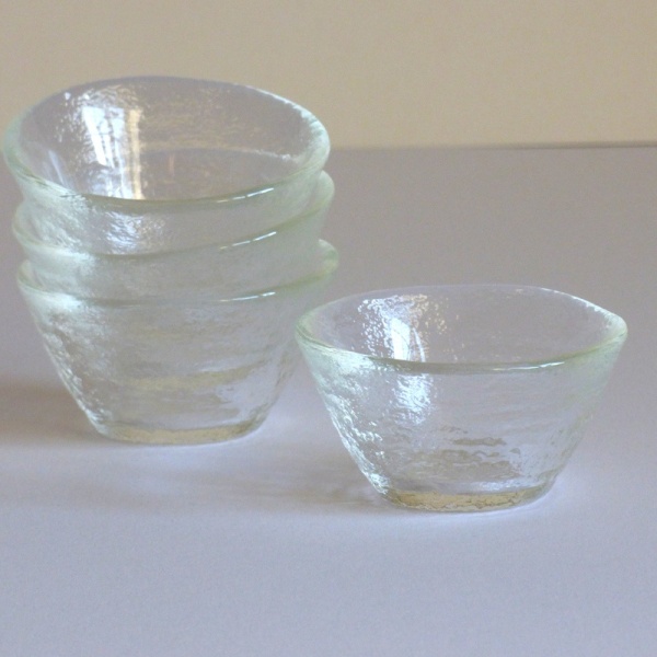 Four clear glass sake cups