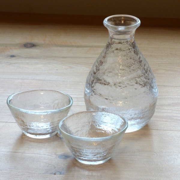 Mount Fuji glass sake jug on table with two sake glasses