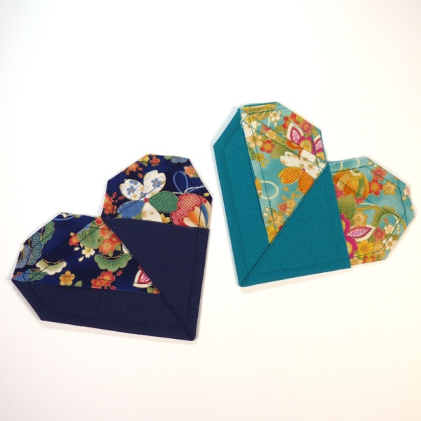 Two heart shaped coasters in vibrant blue and turquoise Japanese fabric