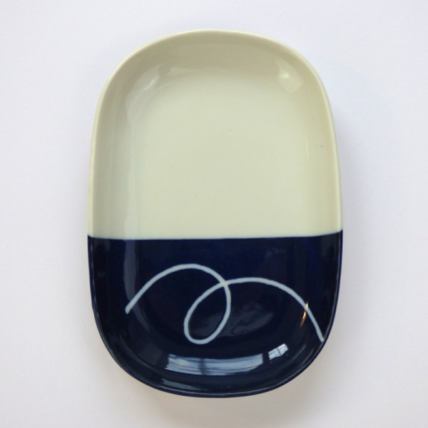 Oval Japanese ceramic plate with navy blue dipped glaze design