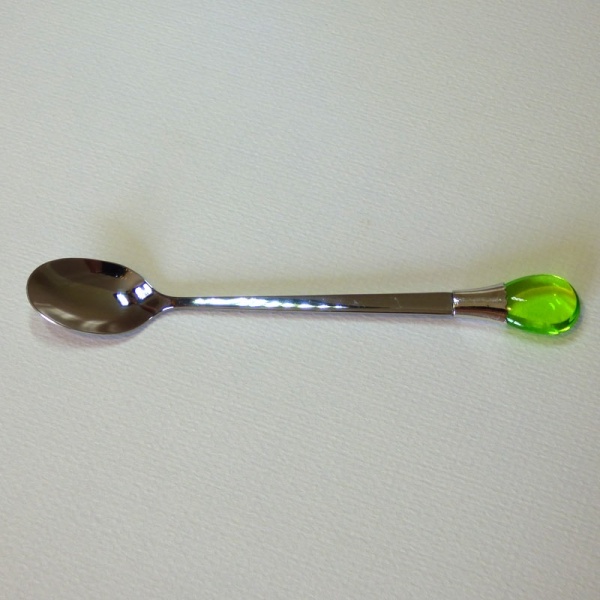 Teaspoon with green coloured gem ornament