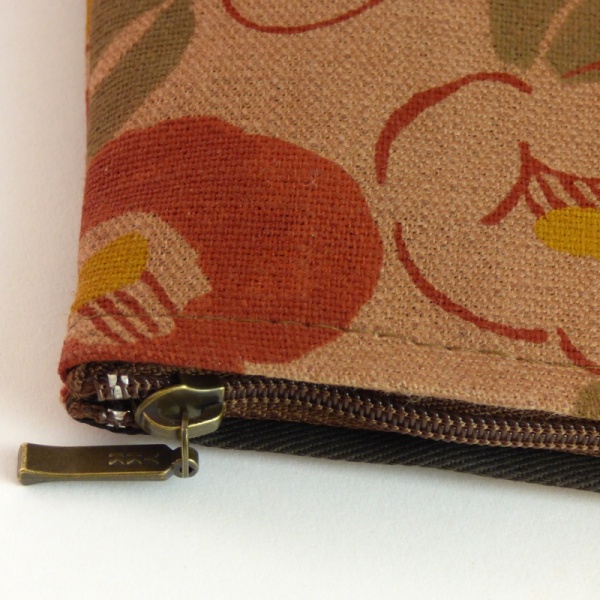 Close up of canvas zip bag with Camellia design