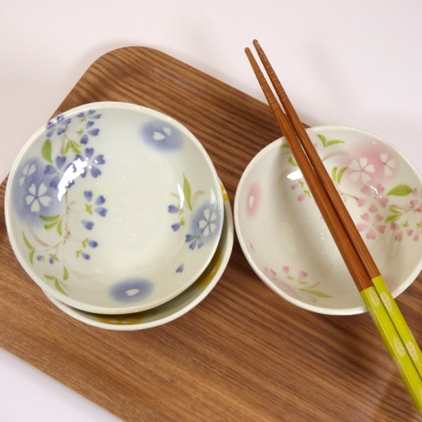 Three 'Petal' bowls on a tray with chopsticks