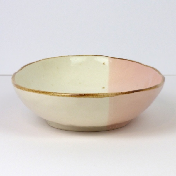 Pink and white oval curry plate showing dip glaze design