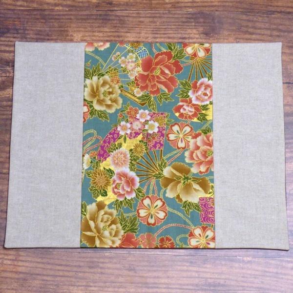 Japanese fabric placemat with vibrant flowers and fans design