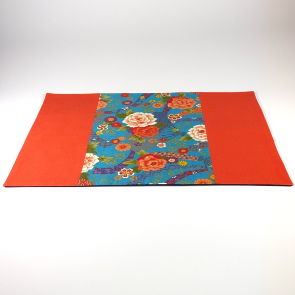 Japanese fabric placemat with orange and turquoise floral design