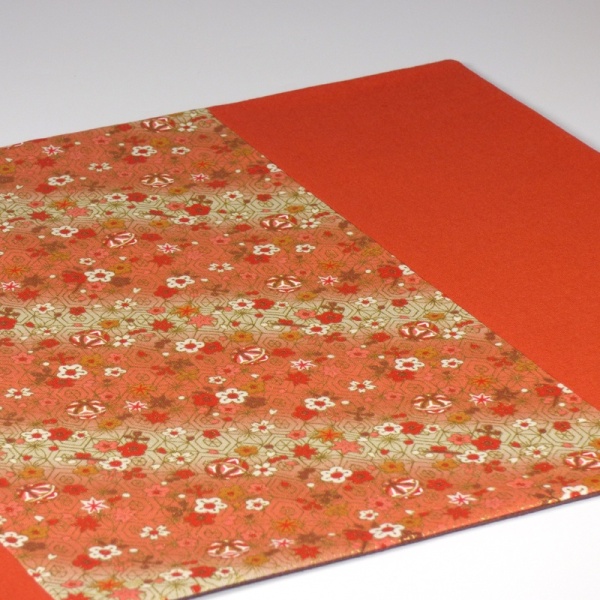 Close up of Flowers & Bells orange fabric placemat