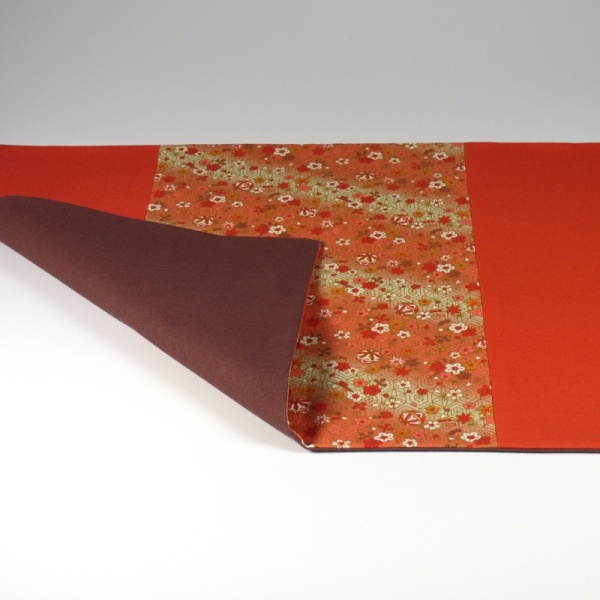 Orange Bells fabric placemat showing plain backing