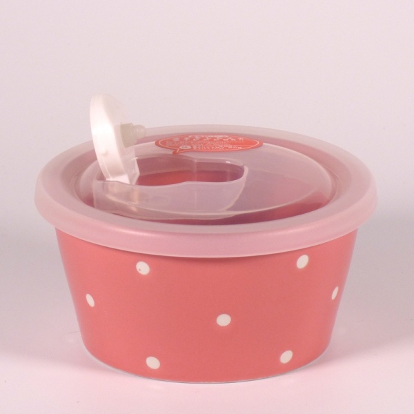 Small pink ceramic food storage and microwave dish