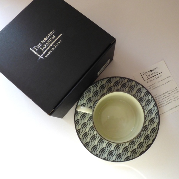 Coffee cup and saucer with black gift box