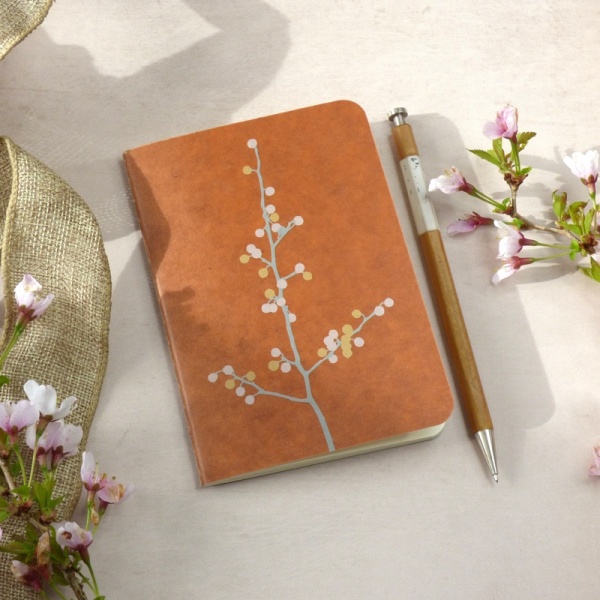 Blossom Branch Ro-biki notebook on writing table