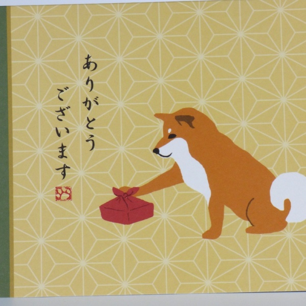 Close up of dog character and Japanese thank you message