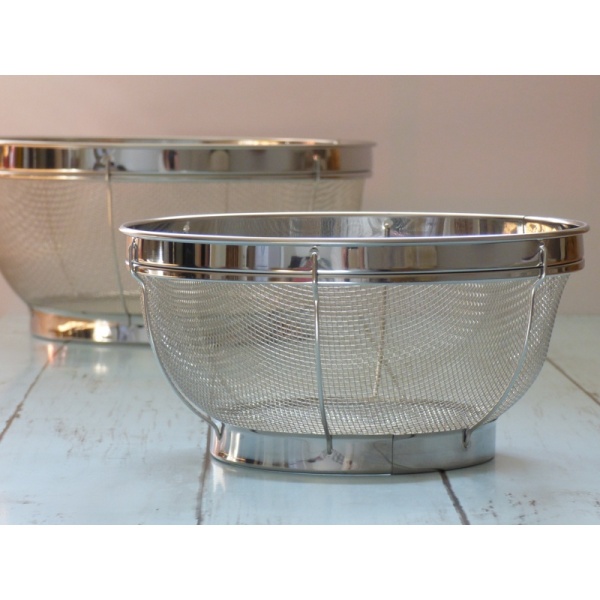 Smaller of the two kitchen sieves standing on work surface