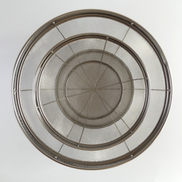 Top down view of two large Japanese stainless steel sieve baskets
