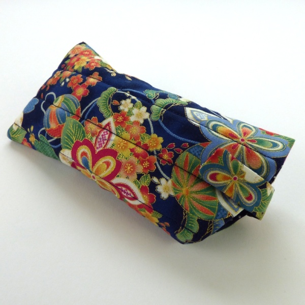 Sunglasses case in dark blue traditional Japanese fabric with sunglasses inserted and closed fastening