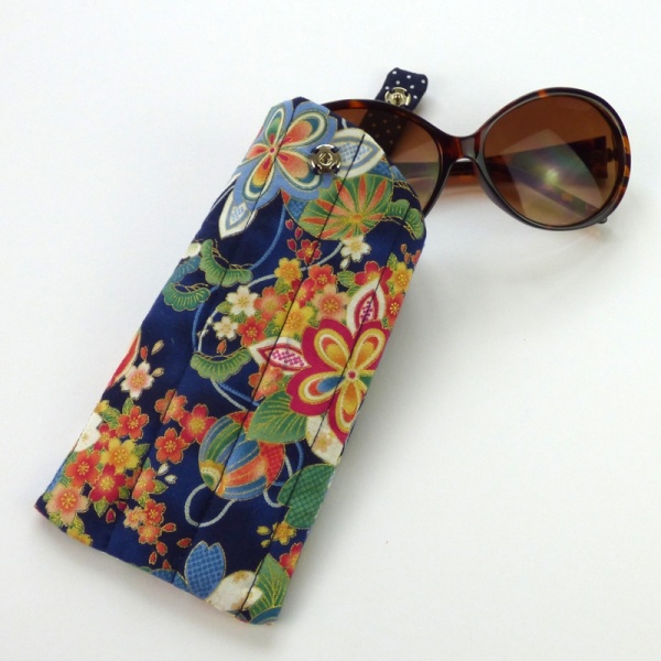 Sunglasses case in dark blue traditional Japanese fabric with sunglasses inserted