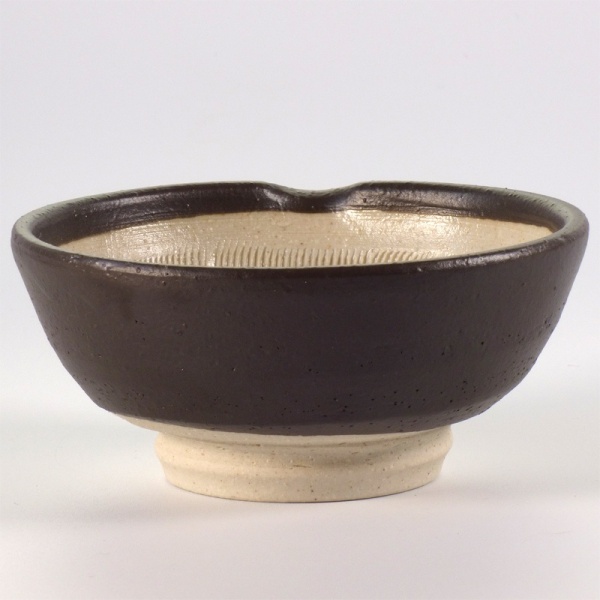 Small Japanese suribachi bowl with black glaze