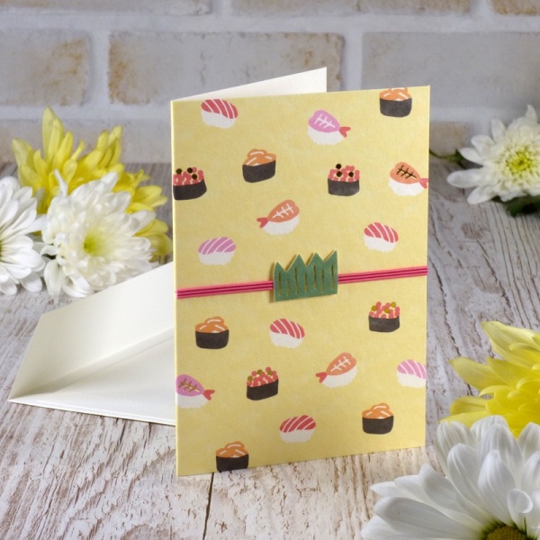 Sushi design Japanese greeting card on table surface