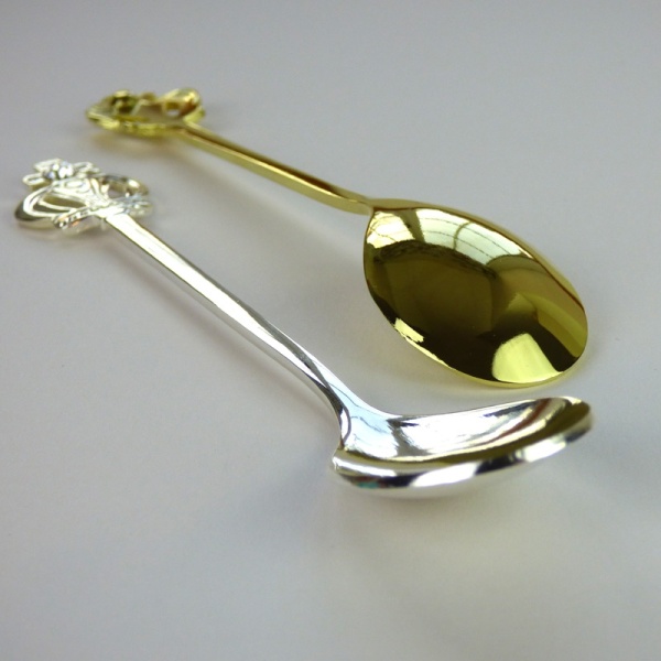 Royal Crown teaspoons in gold and silver