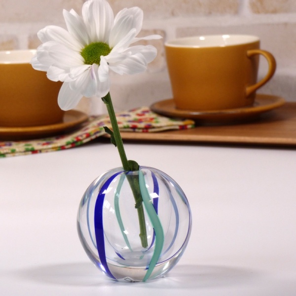 White daisy in blue 'Temari' vase