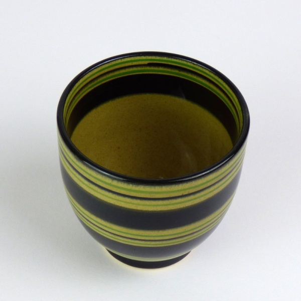 Black Japanese tea cup with green stripe pattern top view