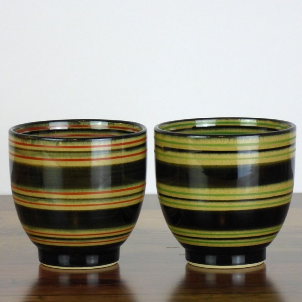 Pair of Japanese tea cups with green and red stripe patterns
