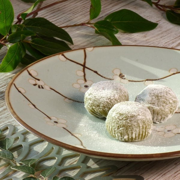 Pale blue plum blossom plate with green tea mochi