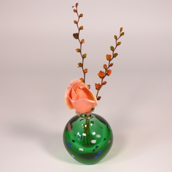 Japanese green glass vase with mini ikebana arrangement