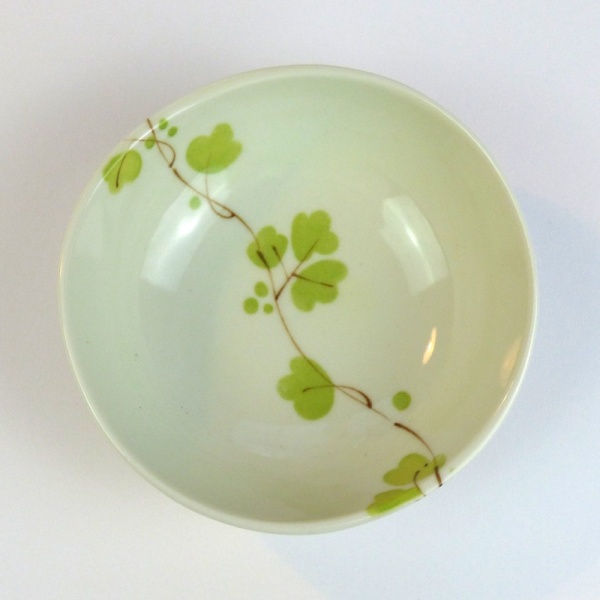 Ceramic bowl with green vine flowers pattern