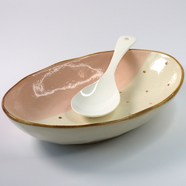 White enamel Japanese serving spoon in pink curry bowl