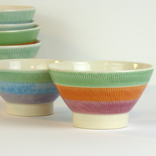 Hasami ware Japanese ceramic bowl with green, orange and red striped pattern