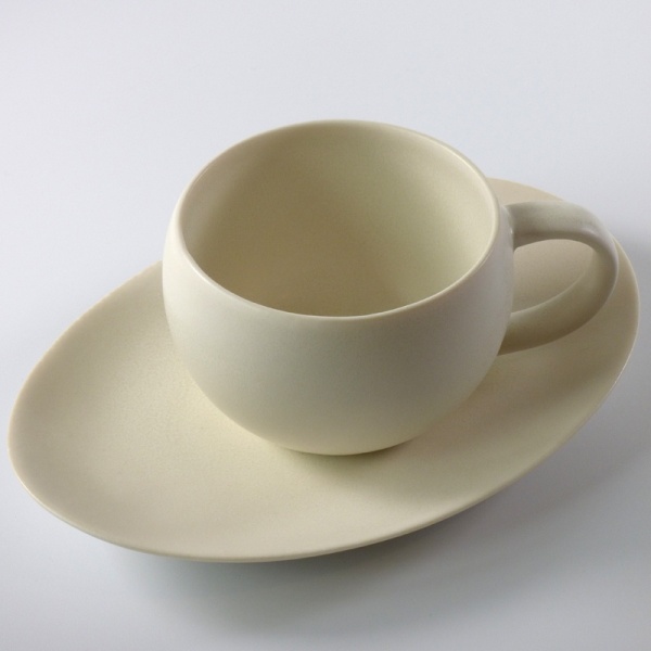 White Japanese cup with oval saucer