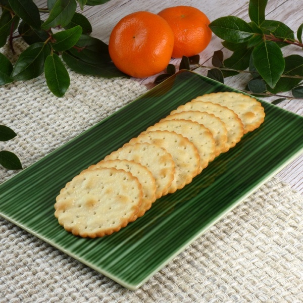 Green rectangular serving plate with crackers