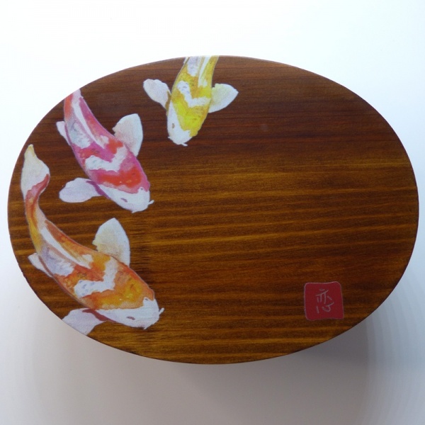 Nishikigoi painted design of three colourful goldfish