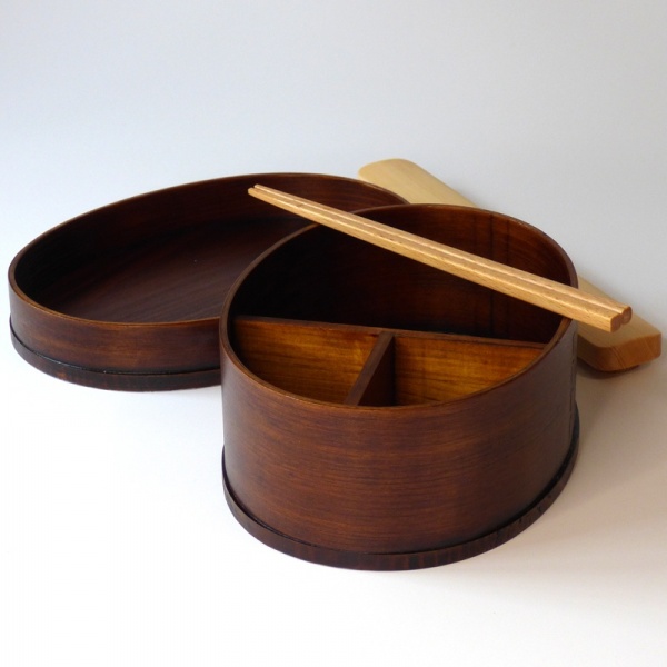 Dark wood bento box with wooden chopsticks
